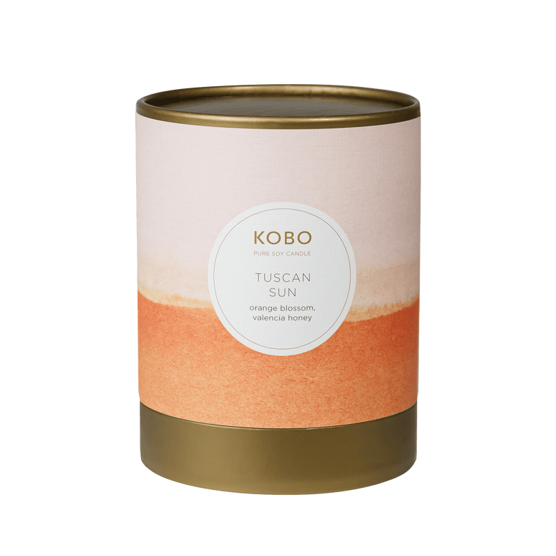 Front view of Tuscan Sun Watercolor Candle showcasing orange and beige design on a brown vessel