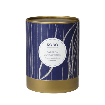 Front view of Saffron Sandalwood Coastal Candle showcasing a navy patterned pure soy vessel with gold rim and base