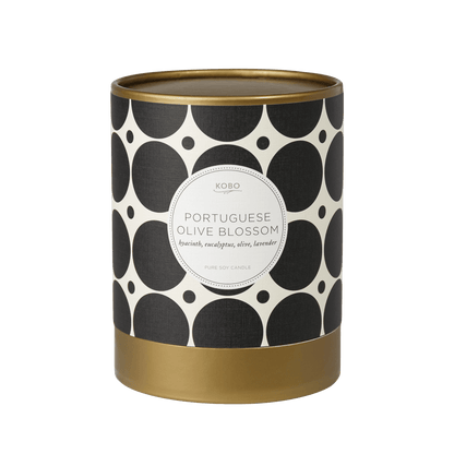 Front view of Portuguese Olive Blossom Coterie Candle showcasing black and white patterned vessel with gold base on a plain background