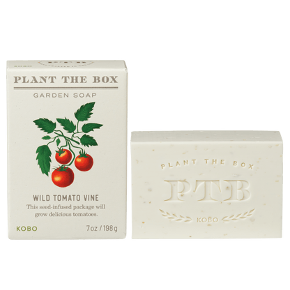 Front view of Wild Tomato Vine Plant The Box bar soap with tomato packaging and embossed soap bar on green background