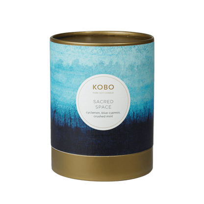 Front view of Sacred Space Watercolor candle showcasing a blue watercolor design and gold base