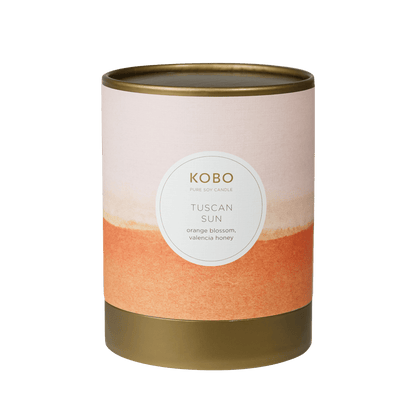 Front view of Tuscan Sun Watercolor Candle showcasing orange and beige design on a brown vessel